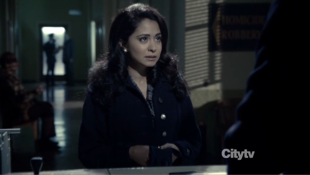 Doctor Sangupta (Parminder Nagra) at the police station.