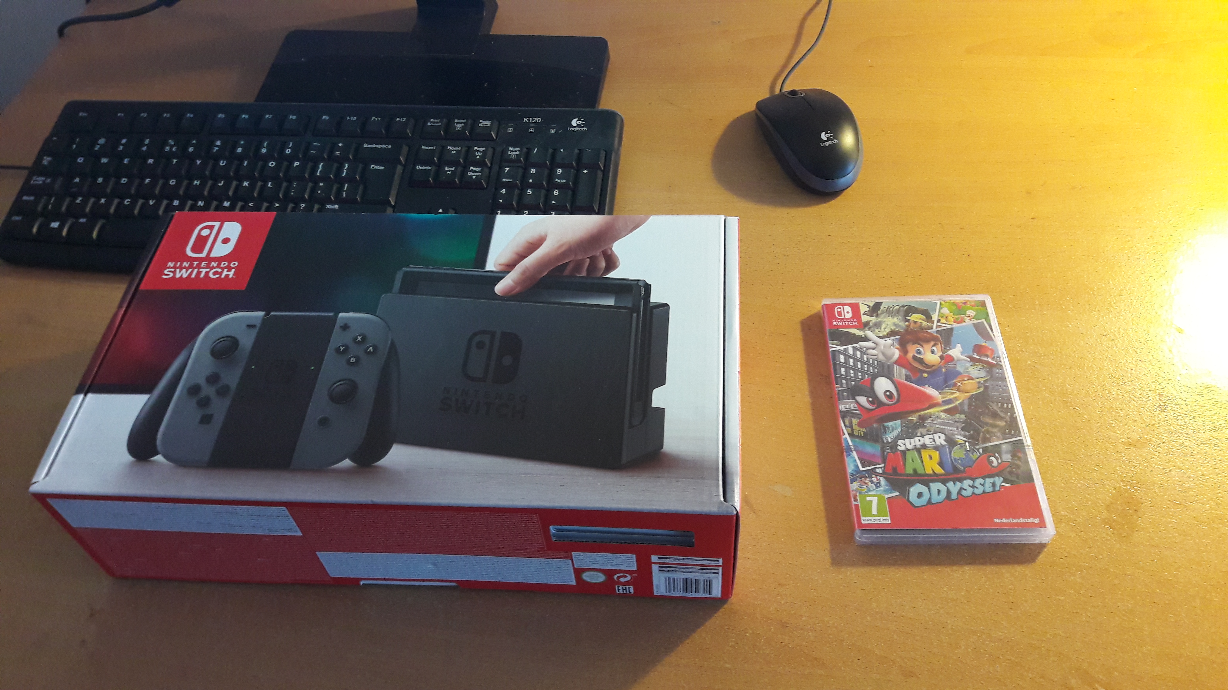 Nintendo Switch box and Super Mario Odyssey