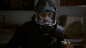 Agent Samantha Shaw (Sarah Shahi) wearing a gas mask - Person of Interest - Relevance