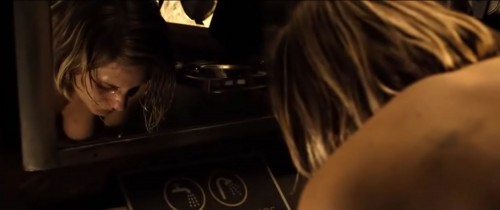 Katee Sackhoff bending over topless in Riddick