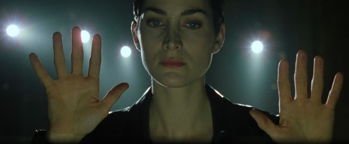 The Matrix - Trinity (Carrie-Anne Moss) holding up her hands