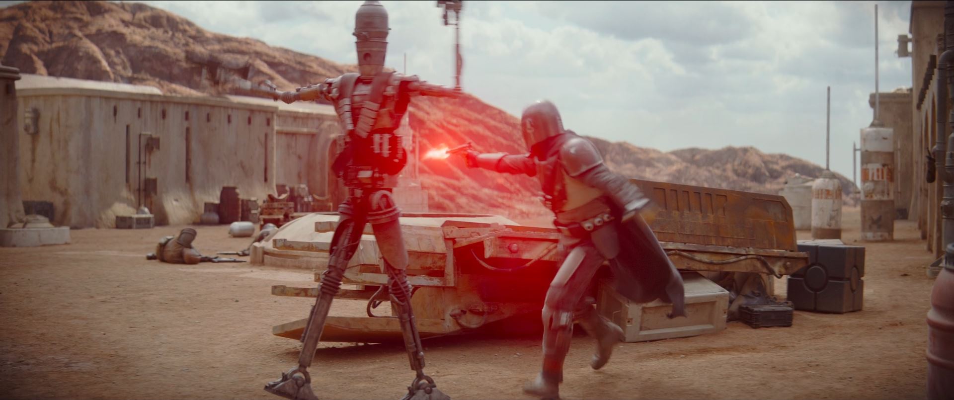 The Mandalorian and IG-11 fight their way through the compound