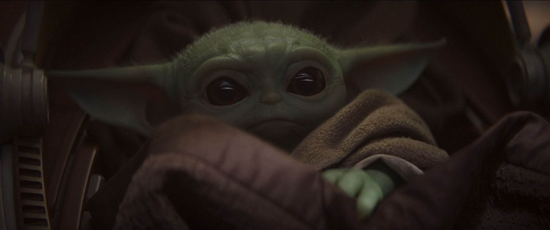 The Mandalorian with baby Yoda